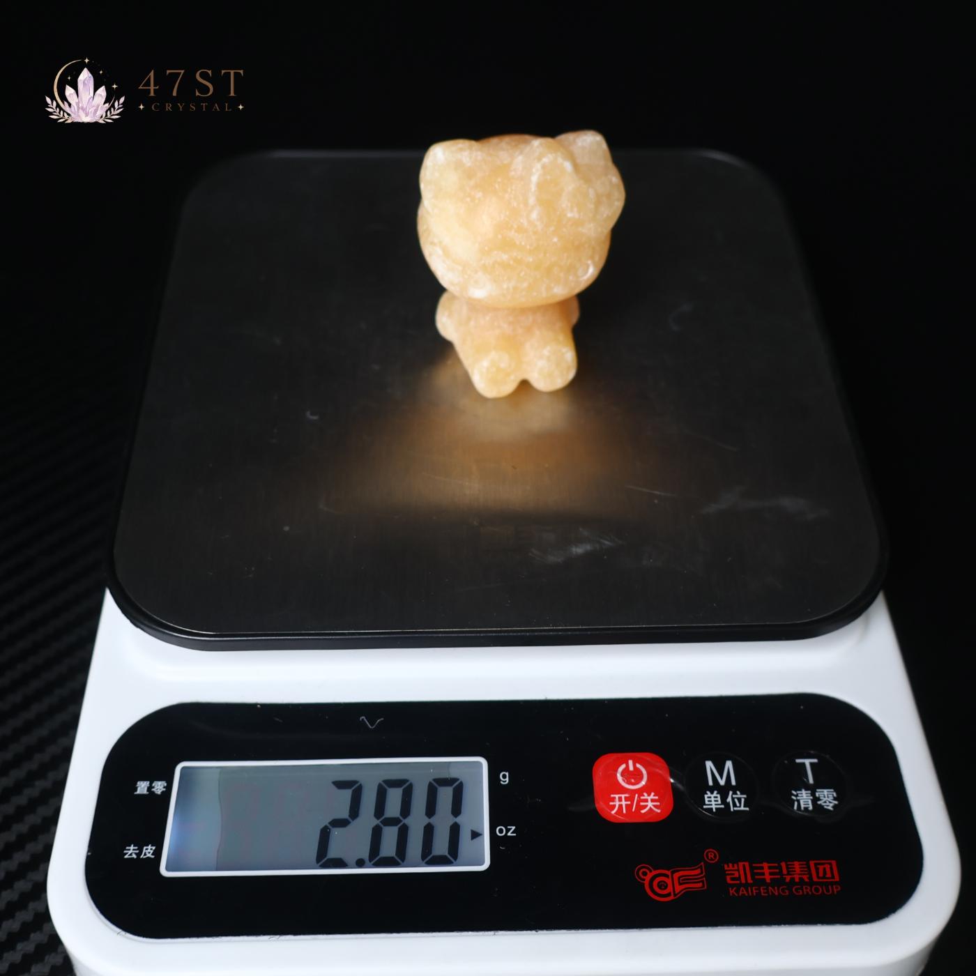 Orange Calcite Hello Kitty Carving