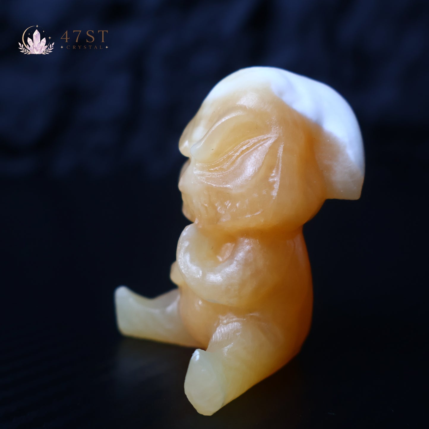 Orange Calcite Yoda Carving