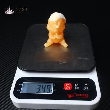 Orange Calcite Yoda Carving