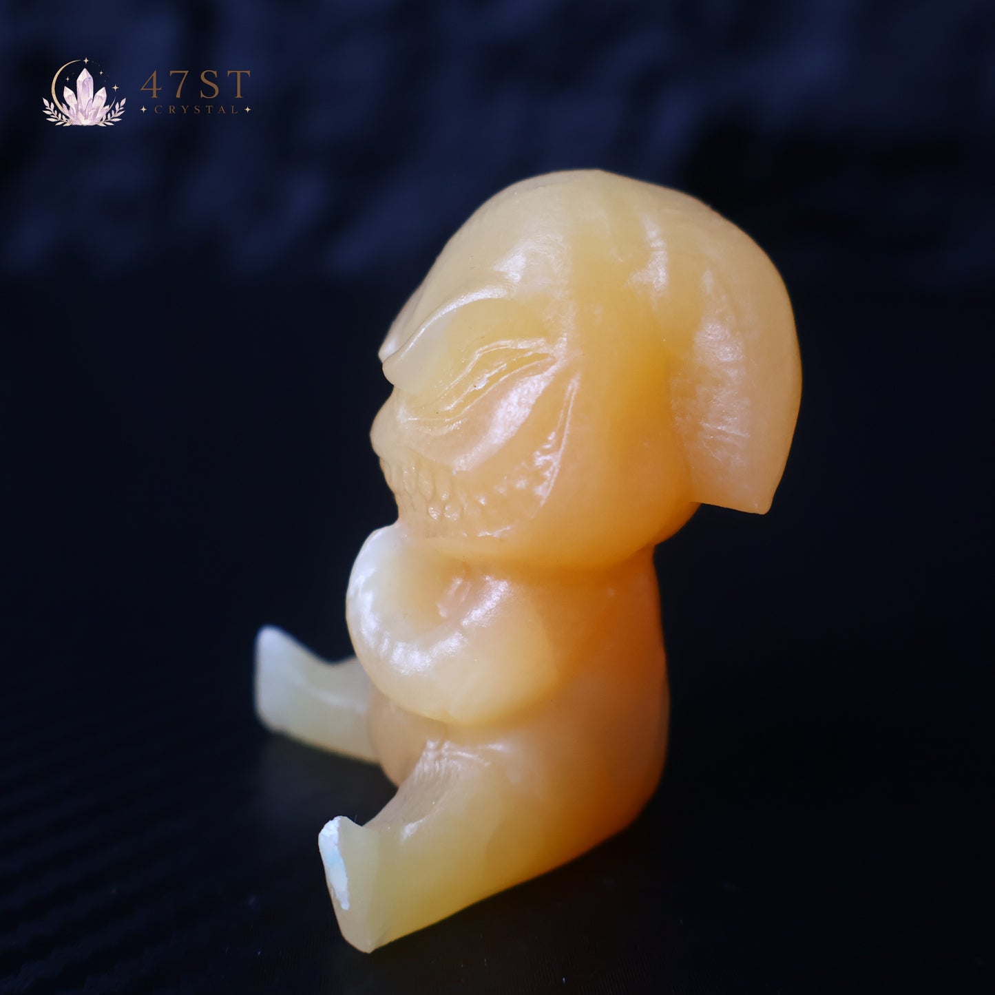 Orange Calcite Yoda Carving