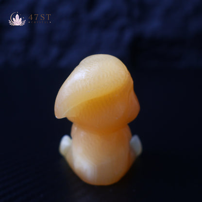 Orange Calcite Yoda Carving