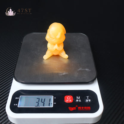Orange Calcite Yoda Carving