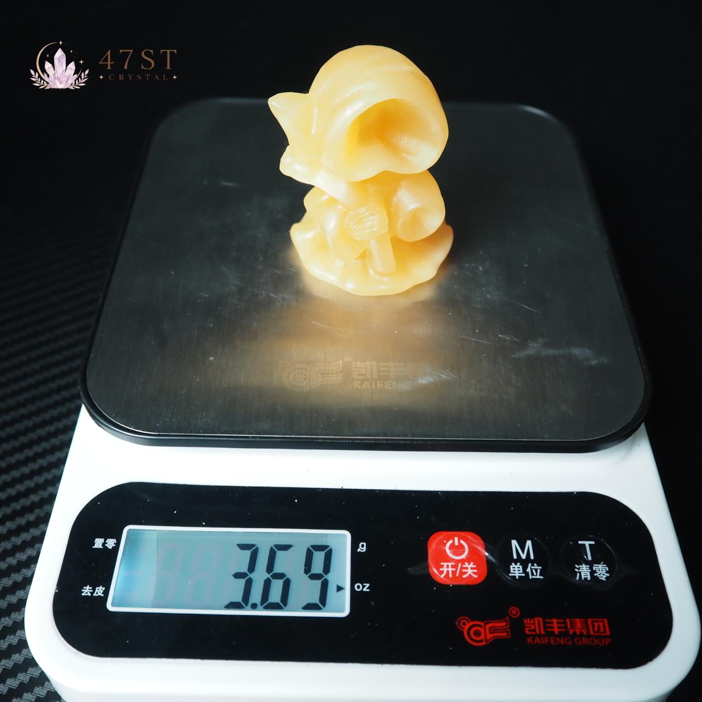 Orange Calcite Grim Reaper Carving